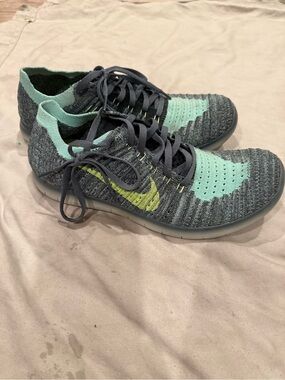 Nike Kids Flyknit Sneakers - Mint Green & Dark Gray with Yellow Swoosh